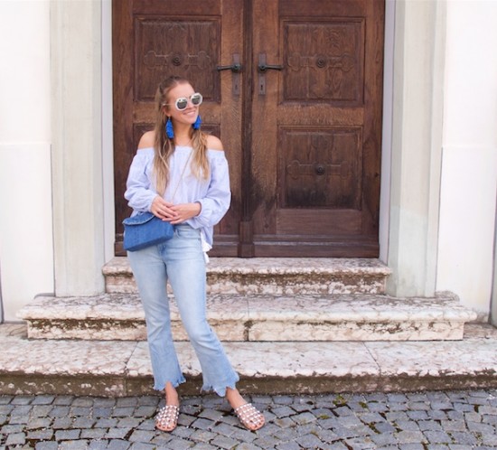 All Things Blue. Fashion Blogger Girl by Style Blog Heartfelt Hunt. Girl with blond half-up half-down hairstyle wearing a blue striped off shoulder blouse, blue destroyed jeans, blue diy denim bag, blue diy tassel earrings and studded sandals.