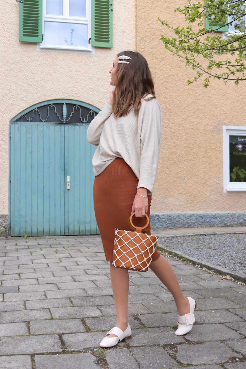 Bucket Bag. Fashion and Style Blog Girl from Heartfelt Hunt. Girl with blonde hair and pearl hair clips wearing a bucket bag, knitted dress, sweater and flats.