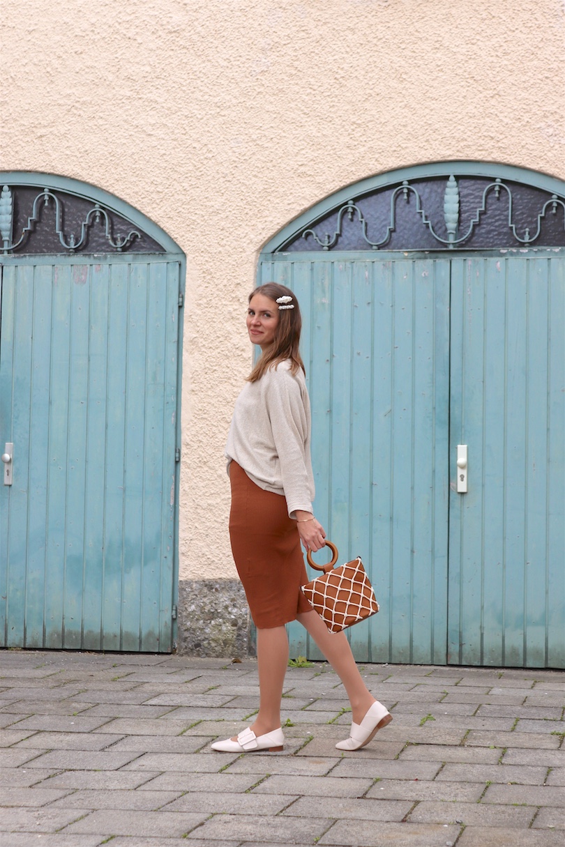 Bucket Bag. Fashion and Style Blog Girl from Heartfelt Hunt. Girl with blonde hair and pearl hair clips wearing a bucket bag, knitted dress, sweater and flats.