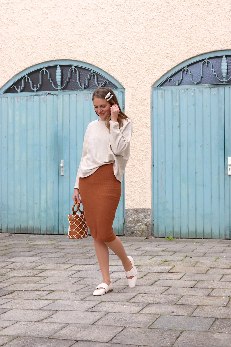 Bucket Bag. Fashion and Style Blog Girl from Heartfelt Hunt. Girl with blonde hair and pearl hair clips wearing a bucket bag, knitted dress, sweater and flats.