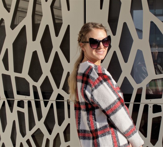 Casual Plaid. Fashion Blogger Girl by Style Blog Heartfelt Hunt. Girl with blond half-up half-down dutch braids wearing a casual plaid sweater, jeans, cat-eye sunglasses, backpack and adidas sneakers.
