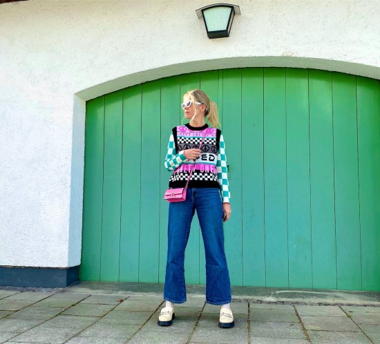 Check Board Patterns. Fashion Blogger Girl by Style Blog Heartfelt Hunt. Girl with blond hair wearing a check board top, check board knit vest, pink mini bag, wide leg jeans and chunky loafers.