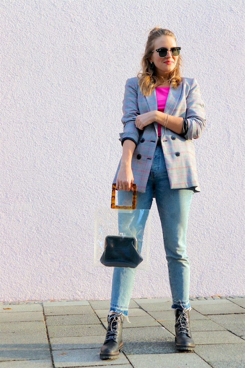 Checked Pink. Fashion Blogger Girl by Style Blog Heartfelt Hunt. Girl with blond hair and scrunchie wearing a checked blazer, pink top, mom jeans, green earrings, green sunglasses, transparent bag, belt and Timberland boots.