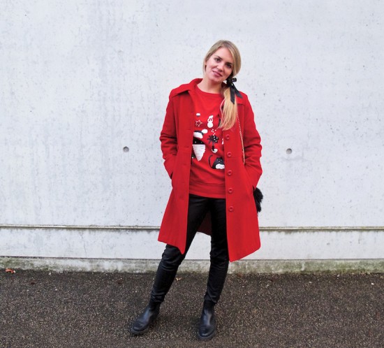 Christmas Sweater. Fashion Blogger Girl by Style Blog Heartfelt Hunt. Girl with blond ponytail and bow wearing a Christmas sweater, leather pants, coat, faux fur bag and boots.