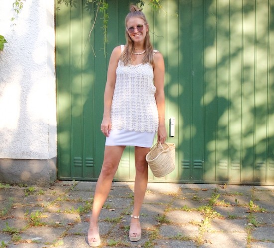 Crochet Top. Fashion Blogger Girl by Style Blog Heartfelt Hunt. Girl with blond half-up half-down hairstyle wearing a crochet top, white dress, sunglasses, straw bag and raffia heels.