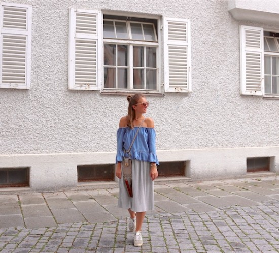 Denim Off Shoulder. Fashion Blogger Girl by Style Blog Heartfelt Hunt. Girl with blond half-up half-down messy bun wearing a denim off shoulder top, pleated skirt, nude sunglasses, Chloé bag and adidas sneakers.