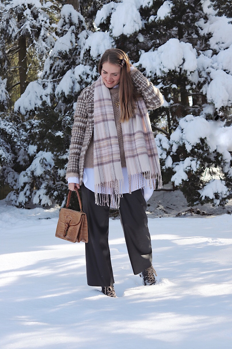 Double Plaid. Fashion Blogger Girl by Style Blog Heartfelt Hunt. Girl with blond hair wearing a plaid scarf, plaid blazer, long blouse, sweater, leather culottes, purse and boots.