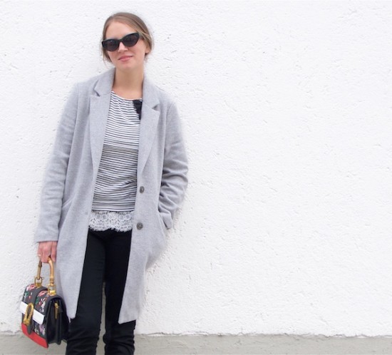 Embroidered Bag. Fashion Blogger Girl by Style Blog Heartfelt Hunt. Girl with blond, low messy bun wearing a gray coat, striped top, lace top, jeans, sunglasses, embroidered bag and Converse sneakers.
