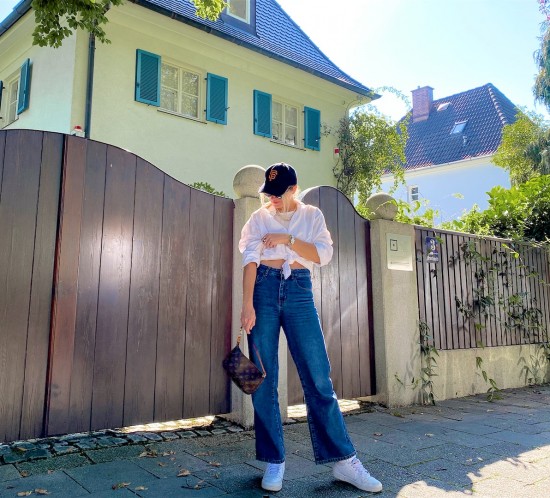 Fashion Basics. Fashion Blogger Girl by Style Blog Heartfelt Hunt. Girl with blond hair wearing a white shirt, wide leg jeans, white top, cap, cat-eye sunglasses, Louis Vuitton bag and Nike sneakers.