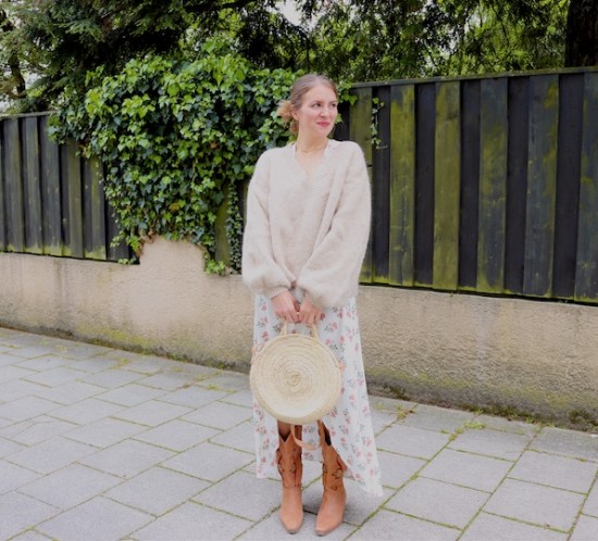 Floral Beige. Fashion Blogger Girl by Style Blog Heartfelt Hunt. Girl with blond hair wearing a floral wrap dress, beige sweater, round straw bag and cowboy boots.