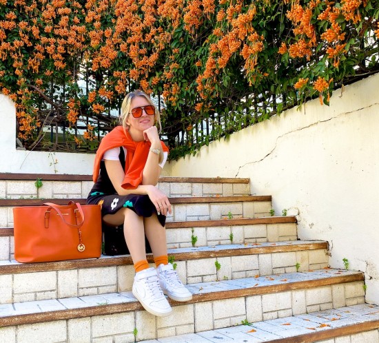 Flower Knit Dress. Fashion Blogger Girl by Style Blog Heartfelt Hunt. Girl with blond hair wearing a flower knit dress, orange hoodie, white T-shirt, orange sunglasses, orange Michael Kors bag, orange socks and white Nike sneakers.