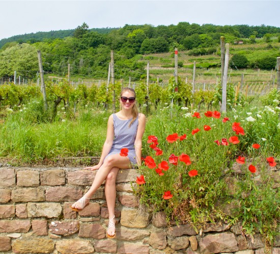 Gingham Dress. Fashion Blogger Girl by Style Blog Heartfelt Hunt. Girl with high ponytail wearing a backless gingham dress, sunglasses and sandals.