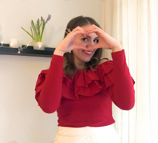 Happy Valentines Day 2020. Fashion Blogger Girl by Style Blog Heartfelt Hunt. Girl with blond, loose waves and pearl & LOVE hair clips wearing a red off shoulder top with ruffles and lace skirt.