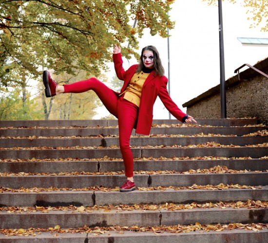 Joker Halloween Costume. Fashion Blogger Girl by Style Blog Heartfelt Hunt. Girl with blond hair wearing a red suit, yellow vest, blue shirt and brown brogues for her Joker Halloween costume.