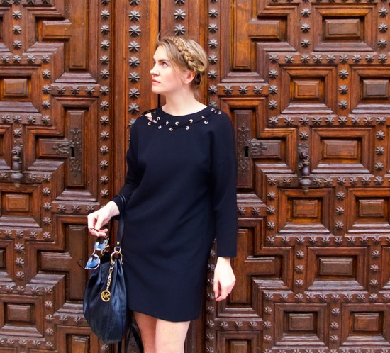Lace Up Dress. Fashion Blogger Girl by Style Blog Heartfelt Hunt. Girl with blond halo braid wearing a black lace up dress, Michael Kors bag, lace up flats and Rayban sunglasses.