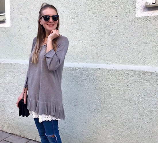 Layering Look. Fashion Blogger Girl by Style Blog Heartfelt Hunt. Girl with blond, loose curls and half-up half-down bun wearing a sweater with ruffle, lace dress, destroyed jeans, bag and adidas sneakers.