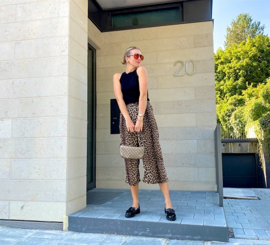 Leopard Pants. Fashion Blogger Girl by Style Blog Heartfelt Hunt. Girl with blond sleek low bun wearing leopard pants, black top with bow, orange sunglasses, vintage Gucci bag and loafers.