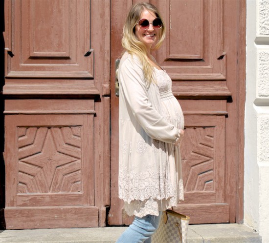 Maternity Jeans. Fashion Blogger Girl by Style Blog Heartfelt Hunt. Girl with blond, loose curls wearing some maternity jeans, lace dress, cardigan, Louis Vuitton bag and ankle boots.