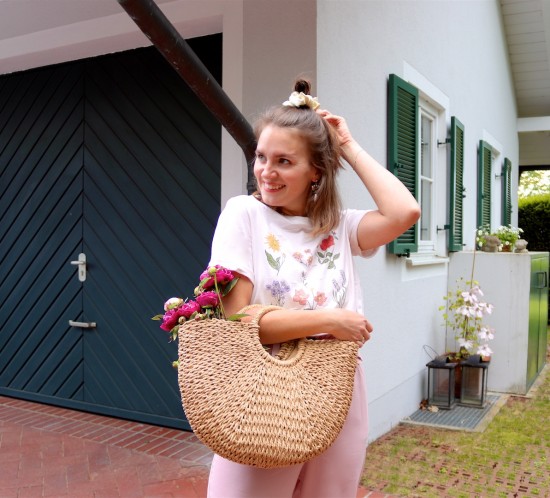 Peony Season. Fashion Blogger Girl by Style Blog Heartfelt Hunt. Girl with blond half-up half-down hairstyle and scrunchie wearing a graphic tee, paperbag culottes, eye earrings, straw bag and straw flats. Summer Looks and Styles.