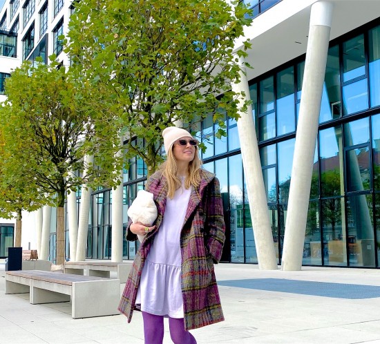 Purple Plaid. Fashion Blogger Girl by Style Blog Heartfelt Hunt. Girl with blond hair wearing a purple plaid coat, purple tights, purple dress, beanie, slim sunglasses, faux fur bag and chunky loafers.