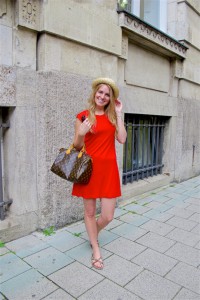Red Dress. Fashion and Style Blog Girl from Heartfelt Hunt. Girl with blonde loose curls wearing a red dress, straw hat, Louis Vuitton bag, Ray-Ban sunglasses and sandals.