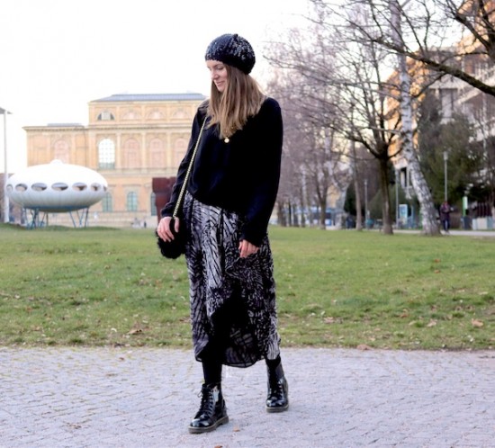 Sequined Beanie. Fashion Blogger Girl by Style Blog Heartfelt Hunt. Girl with blond hair wearing a sequined beanie, black turtleneck sweater, asymmetric midi skirt, faux fur bag and glossy boots.