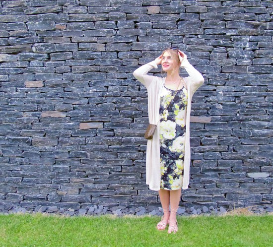 Slate Houses. Fashion Blogger Girl by Style Blog Heartfelt Hunt. Girl with french twist wearing a flower dress, long cardigan, sunglasses, Louis Vuitton bag and lace sandals.