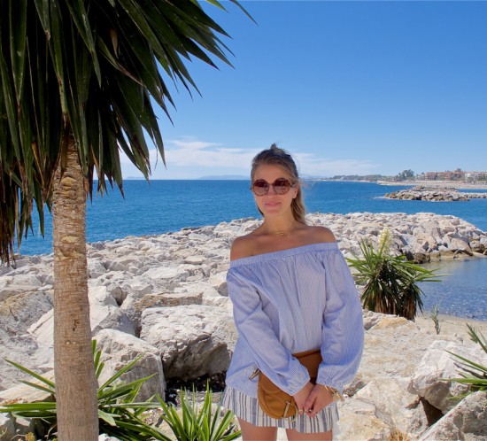 Stripe Lover. Fashion Blogger Girl by Style Blog Heartfelt Hunt. Girl with blond half-up half-down knot wearing a striped off-shoulder top, striped shorts, sunglasses, Dior bag and lace up sandals.