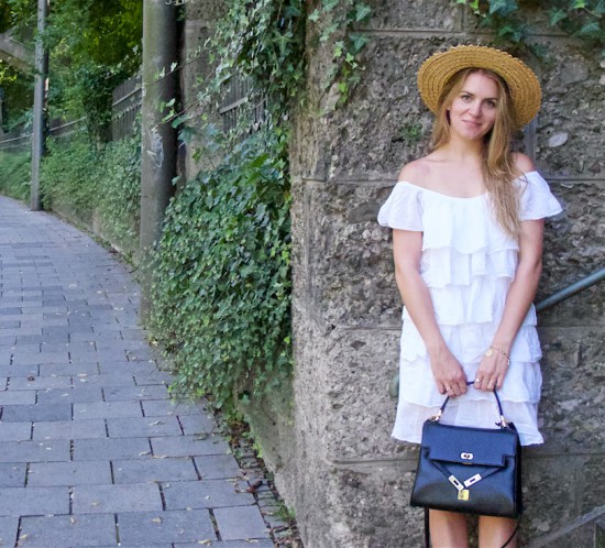 Summer Contrast. Fashion Blogger Girl by Style Blog Heartfelt Hunt. Girl with blond hair wearing a white off-shoulder dress, straw hat, vintage MCM bag and Birkenstock sandals.