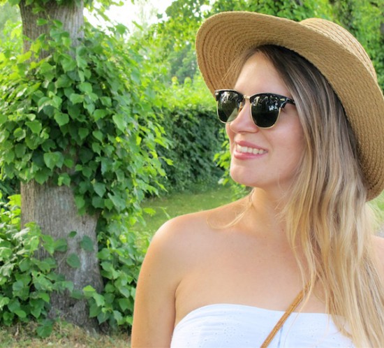 Summer White Straw. Fashion Blogger Girl by Style Blog Heartfelt Hunt. Girl with blond, long hair wearing a summer white dress, straw hat, Ray-Ban sunglasses, basket bag, denim shorts, espadrille sandals.