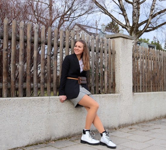 White Boots. Fashion Blogger Girl by Style Blog Heartfelt Hunt. Girl with blond hair and bobby pins wearing white boots, long blazer, white top, checked skirt with ruffles, Louis Vuitton belt bag and earrings.