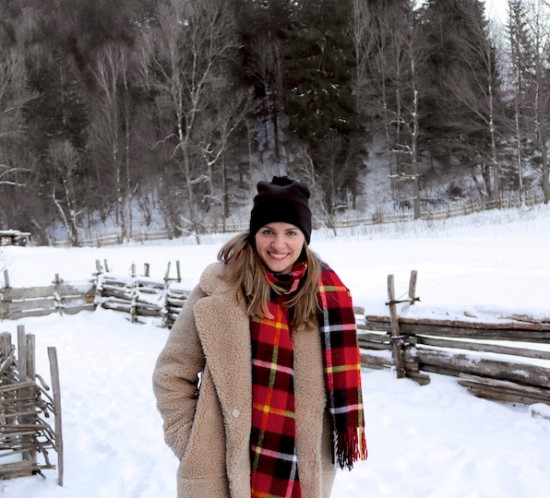 Winter Wonderland. Fashion Blogger Girl by Style Blog Heartfelt Hunt. Girl with blond hair wearing a teddy coat, red sweater, mom jeans, red plaid scarf, beanie with pompom, Rebecca Minkoff backpack and Sorel boots.