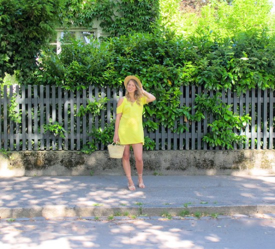 Yellow Cold Shoulder Dress. Fashion and Style Blog Girl from Heartfelt Hunt. Girl with blonde, loose curls wearing a yellow cold shoulder dress, straw hat, basket bag and lace up sandals.