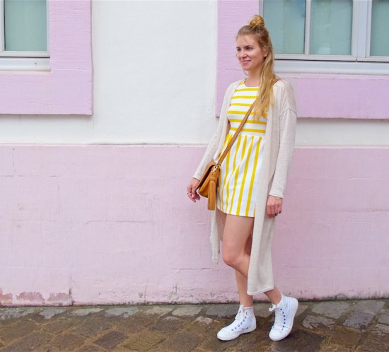 Yellow Striped Dress. Fashion Blogger Girl by Style Blog Heartfelt Hunt. Girl with half-up half-down knot hairstyle wearing a yellow striped dress, long cardigan, tassel bag and Converse Chucks.